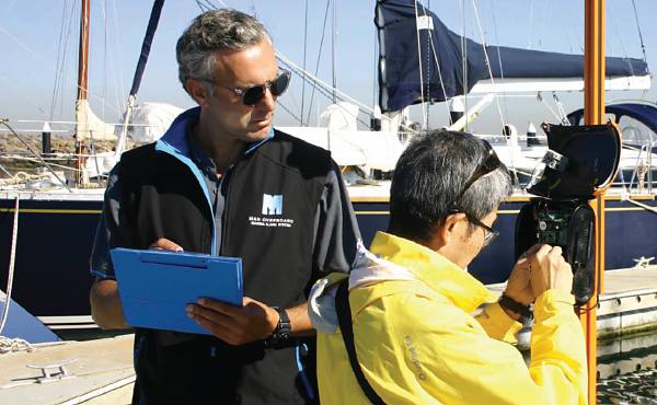 Installing the Man Overboard alarm on its orange pole.