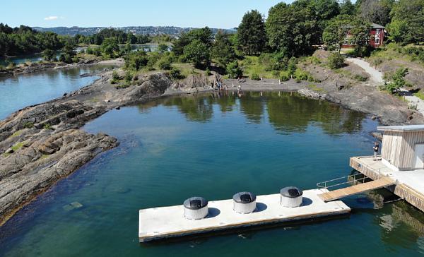 A floating garbage dock helps tourists keep a small Norwegian island clean.