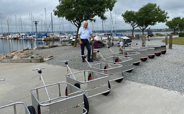 MarinaTrolley customer Hans Lindum Mller, harbour master at Marina Minde in Denmark, with his line-up of trolleys.